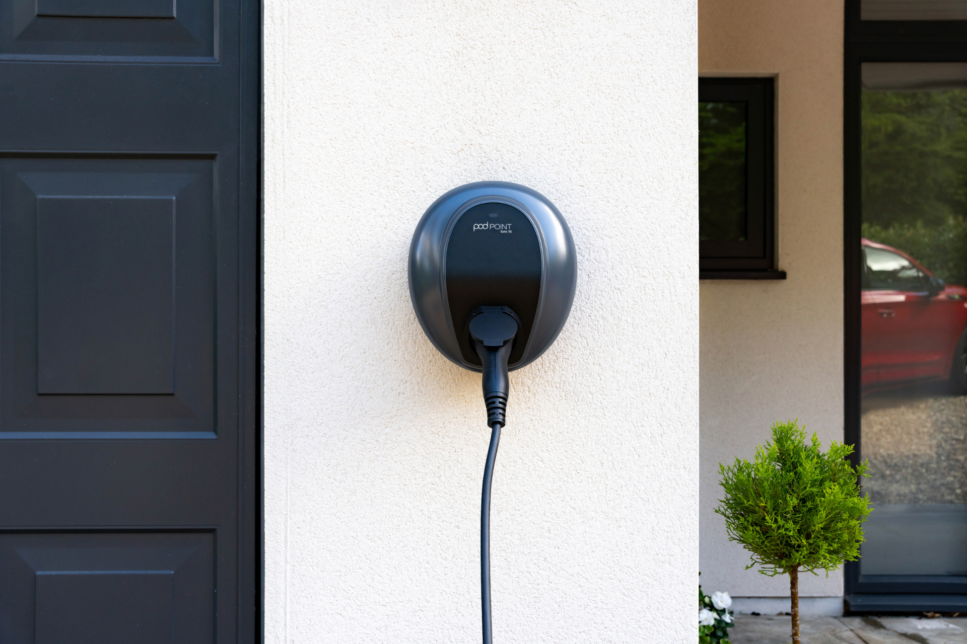 Pod Point EV charger mounted on an exterior wall